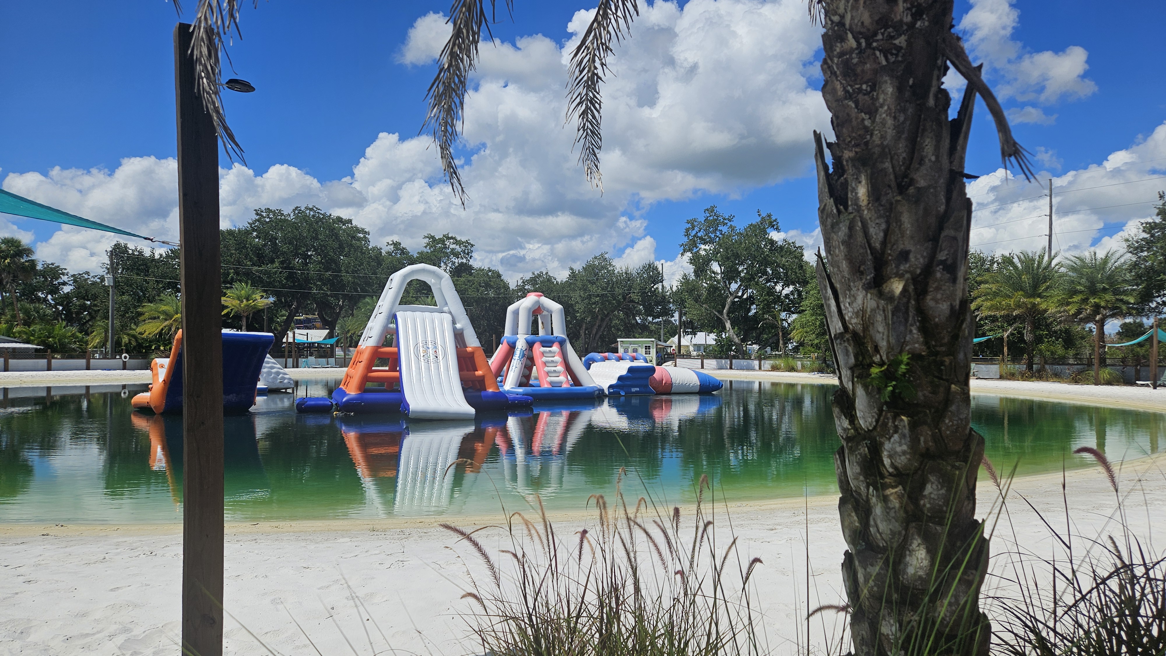 Camp Impact clear swimming lake and inflatables